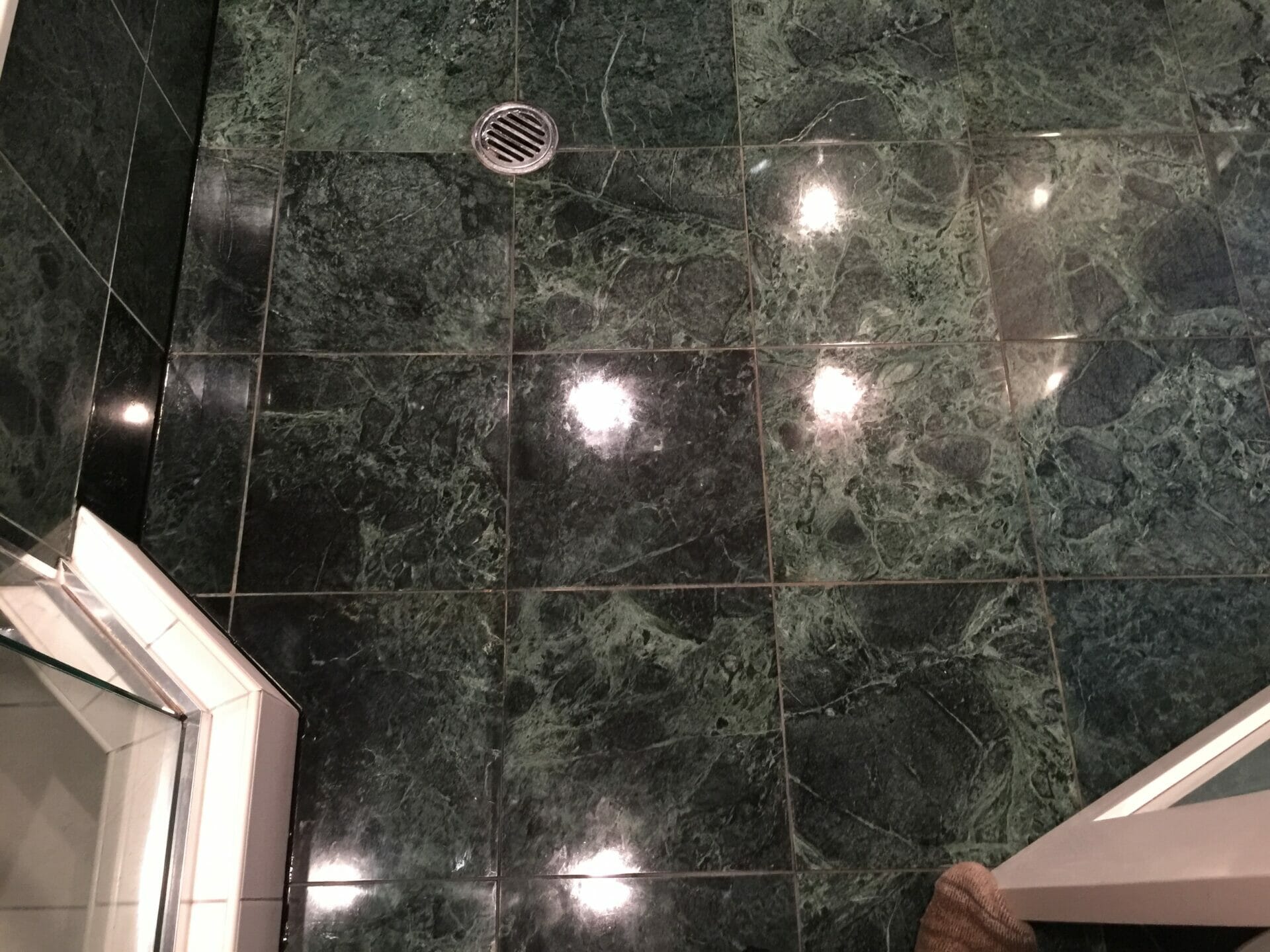 Green marble shower after polishing