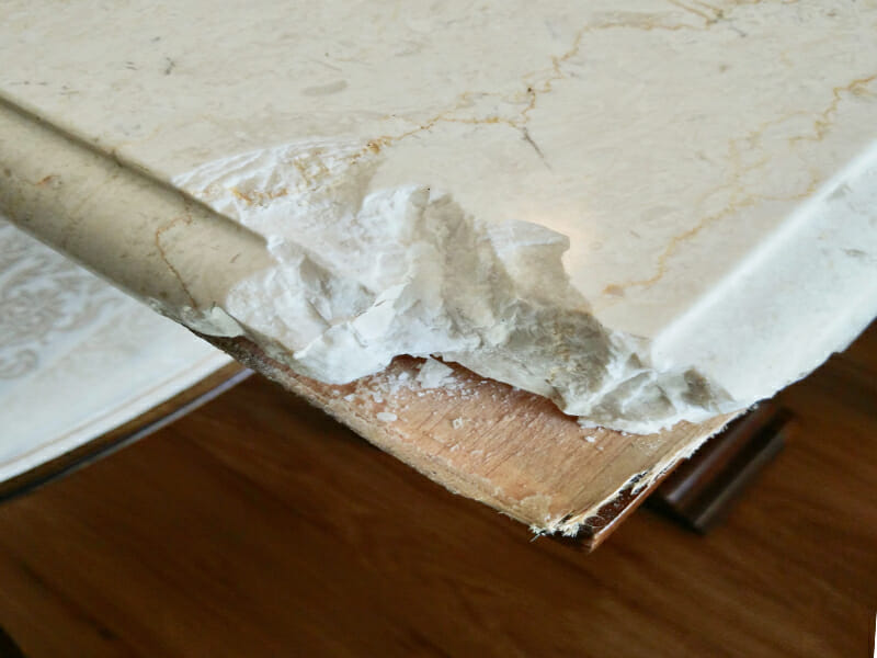 White marble coffee table chip repair BEFORE