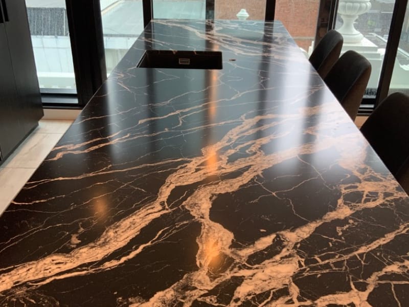 Black and cream marble benchtop after honing and Satin Tuffskin