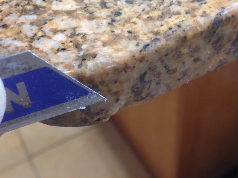 Granite benchtop before repair